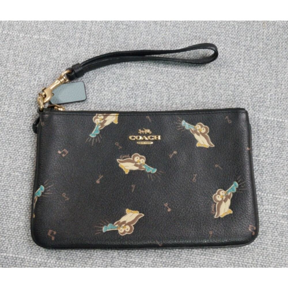 Coach Corner Zip wristlet with penquins